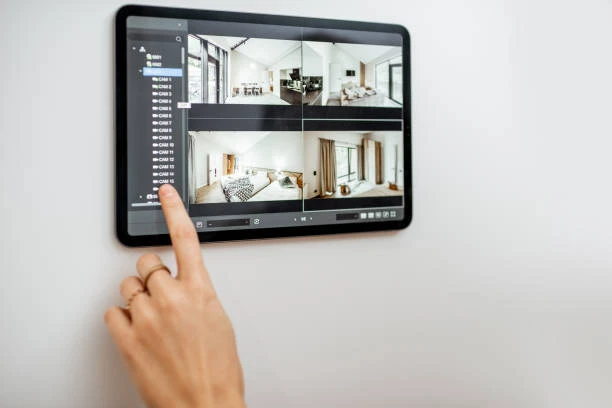 Home automation system displayed on a tablet with multiple room images for control